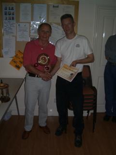 Howard Overton being presented with his certificate by Jimmy Clews